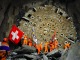 Les mineurs célèbrent, drapeau au poing, le percement du plus long tunnel ferroviaire au monde. Les mineurs célèbrent, drapeau au poing, le percement du plus long tunnel ferroviaire au monde.