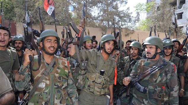 Des soldats de l'armée régulière à Damas le 4 août 2012 Des soldats de l'armée régulière à Damas le 4 août 2012