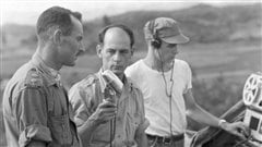 Radio-Canada International journalist Rene Levesque interviews Lt.-Col. Jacques Dextraze in Korea in 1951, while technician Norman Eaves looks on. (National Defence/Radio-Canada/CBC Still Photo Collection) Radio-Canada International journalist Rene Levesque interviews Lt.-Col. Jacques Dextraze in Korea in 1951, while technician Norman Eaves looks on. (National Defence/Radio-Canada/CBC Still Photo Collection)