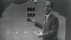 À l'émission Point de mire, le 7 octobre 1958, l'animateur René Lévesque explique aux téléspectateurs le mouvement d'indépendance de l'Algérie. À l'émission Point de mire, le 7 octobre 1958, l'animateur René Lévesque explique aux téléspectateurs le mouvement d'indépendance de l'Algérie.