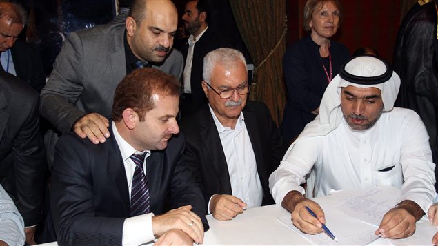 Des membres de la Coalition nationale syrienne réunie à Doha au Qatar Des membres de la Coalition nationale syrienne réunie à Doha au Qatar