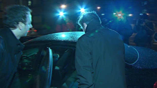 Pierre Duhaime à sa sortie du quartier général de la SQ, à Montréal, mercredi soir Pierre Duhaime à sa sortie du quartier général de la SQ, à Montréal, mercredi soir
