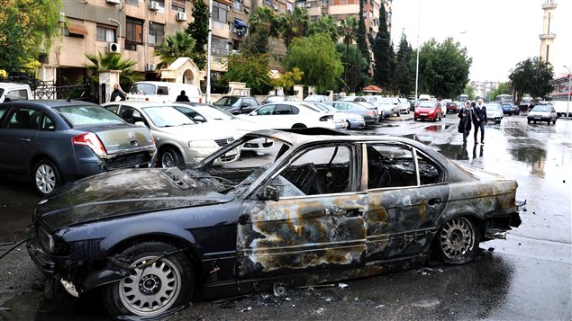 La carcasse d'une voiture piégée à Damas le 6 décembre dernier (archives) La carcasse d'une voiture piégée à Damas le 6 décembre dernier (archives)