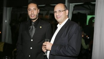 Saadi Kadhafi, fils de Mouammar Kadhafi. en compagnie de Riadh Ben Aïssa, alors vice-président à la division construction de SNC-Lavalin (photo prise à Toronto le 14 septembre 2009) Saadi Kadhafi, fils de Mouammar Kadhafi. en compagnie de Riadh Ben Aïssa, alors vice-président à la division construction de SNC-Lavalin (photo prise à Toronto le 14 septembre 2009)