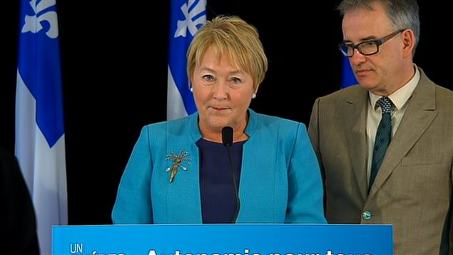 La première ministre Pauline Marois accompagnée du ministre de la Santé Réjean Hébert La première ministre Pauline Marois accompagnée du ministre de la Santé Réjean Hébert