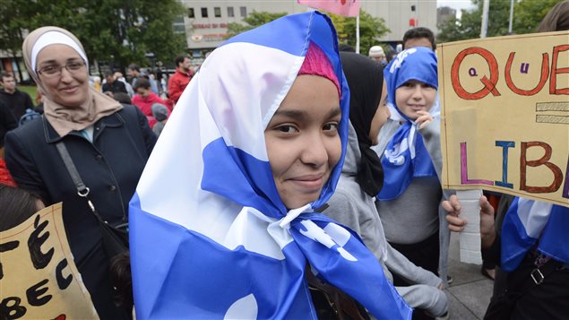 Manifestante contre la charte à Montréal, le 14 septembre 2013. Manifestante contre la charte à Montréal, le 14 septembre 2013.