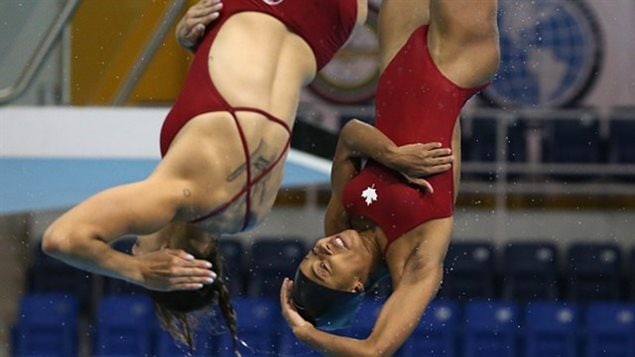 Ware et Jennifer Abel lors de la finale en plongeon synchronisé au tremplin de trois mètres aux Jeux panaméricains Ware et Jennifer Abel lors de la finale en plongeon synchronisé au tremplin de trois mètres aux Jeux panaméricains