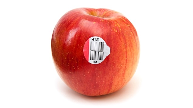 Une pomme et son étiquette à code numérique Une pomme et son étiquette à code numérique