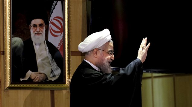 Le président iranien Hassan Rohani, devant un portrait du Guide suprême de la Révolution, Ali Khamenei (archives) Le président iranien Hassan Rohani, devant un portrait du Guide suprême de la Révolution, Ali Khamenei (archives)