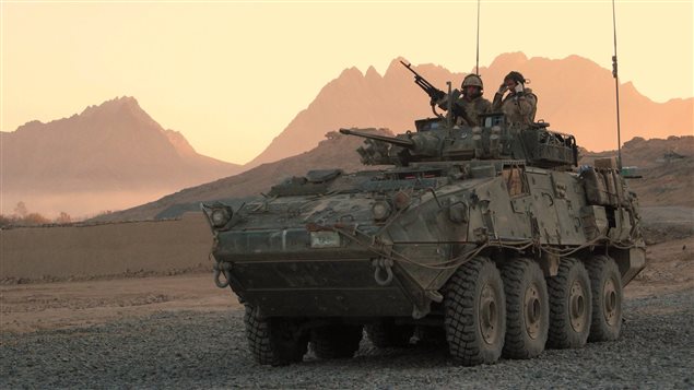 A Canadian LAV (light armoured vehicle) arrives to escort a convoy at a forward operating base near Panjwaii, Afghanistan at sunrise on Nov.26, 2006. A Canadian LAV (light armoured vehicle) arrives to escort a convoy at a forward operating base near Panjwaii, Afghanistan at sunrise on Nov.26, 2006.