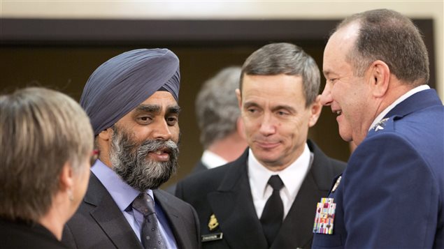 Le ministre canadien de la Défense, Harjit Sajjan (deuxième à gauche) lors de la rencontre de l'Organisation du traité de l'Atlantique nord à Bruxelles. Le ministre canadien de la Défense, Harjit Sajjan (deuxième à gauche) lors de la rencontre de l'Organisation du traité de l'Atlantique nord à Bruxelles.