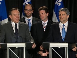 Gérard Deltell et François Legault annoncent officiellement la fusion de l'ADQ et de la CAQ. Gérard Deltell et François Legault annoncent officiellement la fusion de l'ADQ et de la CAQ.
