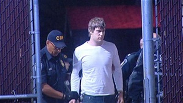 Travis Baugartner lors de son arrestation samedi. Travis Baugartner lors de son arrestation samedi.