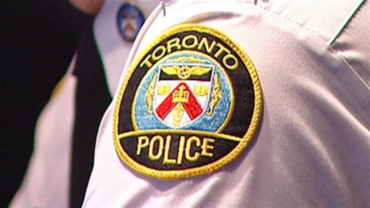 Un badge de la police de Toronto Un badge de la police de Toronto