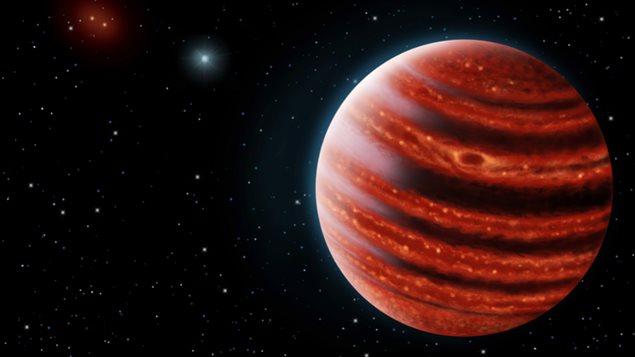 Une conception artistique de l’exoplanète de type Jupiter, vue à la lumière infrarouge, dont les couches chaudes profondes dans son atmosphère sont visibles à travers les nuages. Une conception artistique de l’exoplanète de type Jupiter, vue à la lumière infrarouge, dont les couches chaudes profondes dans son atmosphère sont visibles à travers les nuages.